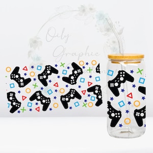 May include: A clear glass water bottle with a bamboo lid and a straw. The bottle has a black and white pattern of video game controllers, stars, circles, squares, and plus signs.
