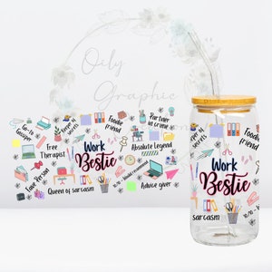 May include: A clear glass jar with a bamboo lid and a straw. The jar has a colorful design with the text "Work Bestie" and other phrases like "Foodie friend", "Keeper of secrets", "Go-to gossiper", "Free therapist", "Fave person", "Queen of sarcasm", "Partner in crime", "Absolute Legend", "10/10 - Would recommend", "Advice giver", "Sarcasm".