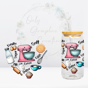 May include: A clear glass tumbler with a bamboo lid and a straw. The tumbler has a design of a pink stand mixer, ingredients, and baking tools. The text on the tumbler reads "Vanilla, Sugar, Milk, Cocoa, Butter, Eggs, Salt".