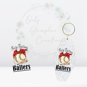 May include: A white glitter keychain with a red and white baseball design. The baseball is wearing a red bandana with white polka dots. The text "Busy Raising Ballers" is printed on the keychain.