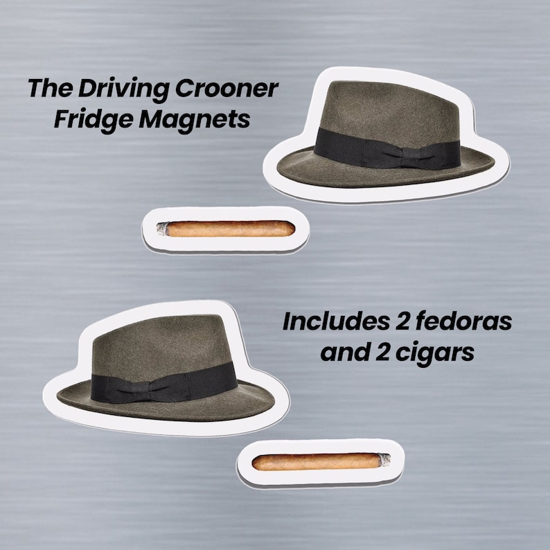 May include: Set of four fridge magnets featuring two brown fedora hats and two brown cigars. The magnets are white with black text that reads "The Driving Crooner Fridge Magnets" and "Includes 2 fedoras and 2 cigars".