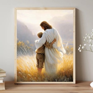 May include: A framed wall art print depicting a long-haired figure in a flowing white robe with an arm around a child wearing tan clothing. They stand together in a golden field of tall grass with soft, hazy mountains in the background.
