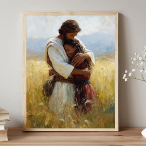 May include: A framed art print depicts a tender embrace. A figure in white robes embraces a person in a red dress. They stand in a field of golden wheat, with a soft blue mountain range in the background. The artwork is in a wooden frame.