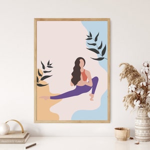 May include: A framed print featuring a woman in a yoga pose with a pink, blue, and orange background. The woman is wearing a red top and purple trousers. The background has abstract shapes and black leaves.