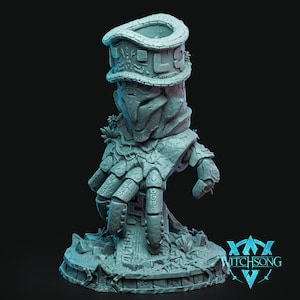 May include: A detailed, light blue sculpture of a hand and arm, with a stylized face and headdress. The sculpture has intricate carvings and is set on a circular base with foliage. The Witchsong logo is visible.