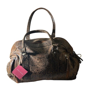 May include: Brown snakeskin-patterned duffel bag with two handles and two zippered side pockets. The bag has a tag that reads "Lara Taylor". The bag is made of a textured material and has silver-colored hardware.