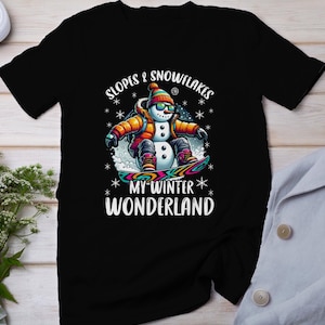 Chemise de snowboard bonhomme de neige, T-shirt de la saison d’hiver, vêtements de snowboard, tee-shirt d’aventure en plein air, tenue de vacances pour activités sportives, chemise de chalet de montagne