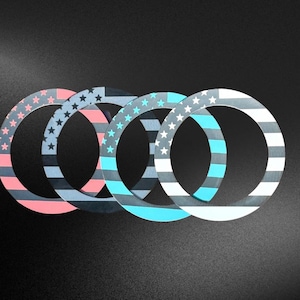 May include: Four circular decorative rings with a patriotic theme. Each ring features a design with stripes and stars in shades of red, blue, gray, and white. The rings are arranged in a row against a dark background.