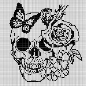 May include: Black and white pixel art design of a skull with a butterfly and roses. The skull is in the center of the design and is surrounded by a butterfly on the left and roses on the right.