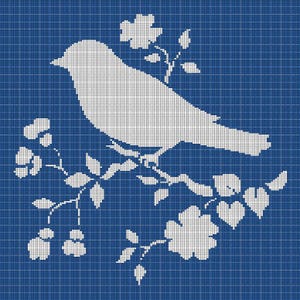 May include: A white bird silhouette perched on a flowering branch against a blue grid background. The bird is detailed with a pixelated design, and the flowers and leaves are also white. The overall design has a vintage, cross-stitch aesthetic.