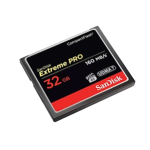 May include: A black and red SanDisk Extreme PRO CompactFlash card. The card has the text "32 GB" in red, "160 MB/s", and "UDMA 7". The SanDisk logo is in white on a red background.