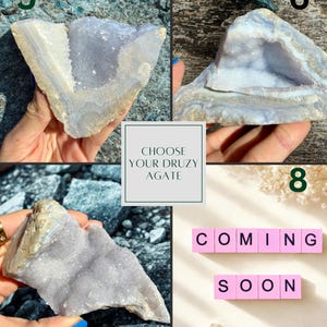 May include: A collection of natural druzy agate stones in blue, grey, and beige hues. The image features the text "CHOOSE YOUR DRUZY AGATE" and the words "COMING SOON" spelled out with pink letter tiles.