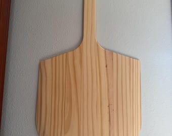 Pine Wood pizza peel with pizza themed engraving. Can be personalized.