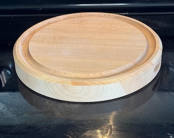Personalized round American maple cutting board with custom engraving by Design-Engrave. 12" round 1.5" thick with juice groove.