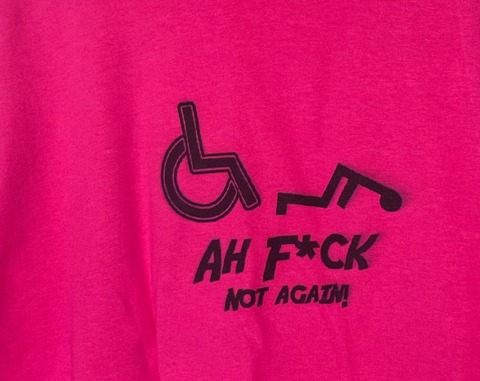 Funny T-shirt. Gildan cotton t-shirt with wheelchair humor printed on the front. Pink cotton shirt.