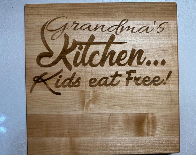 Engraved cutting board made from American maple edge grain wood.