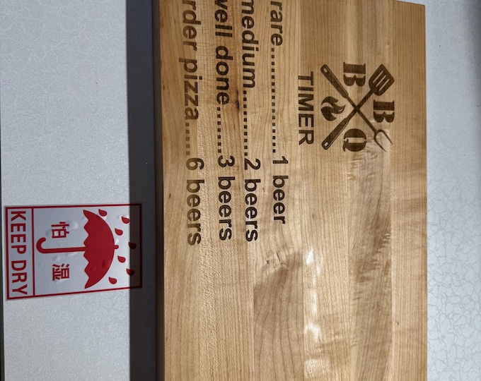 Engraved cutting board made from maple edge grain wood.