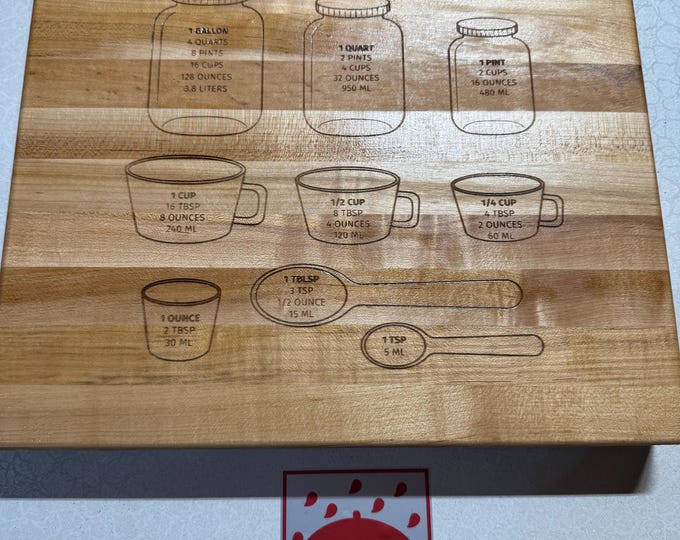 Engraved cutting board made from American maple edge grain wood.