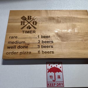 Beer timer engraved cutting board made from maple edge grain wood.
