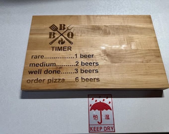 Beer timer engraved cutting board made from maple edge grain wood.