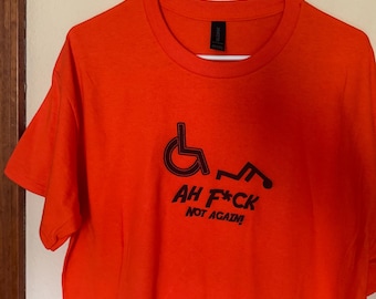 Funny T-shirt. Gildan cotton t-shirt with wheelchair humor printed on the front. Orange cotton shirt.