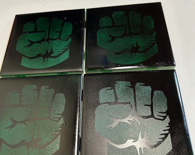 Laser engraved painted tile coasters. Cork base, ceramic tile with hulk hands design.