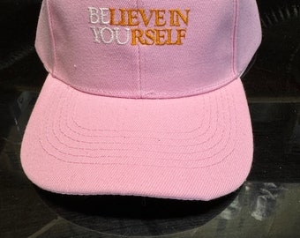 Embroidered Believe in yourself hat. Pink cap with Velcro adjustable strap.