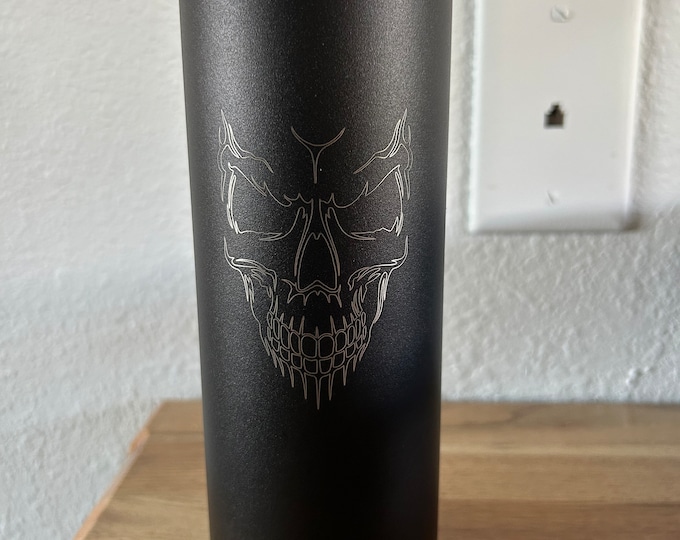 Skinny 20oz stainless steel tumblers with custom engraving.