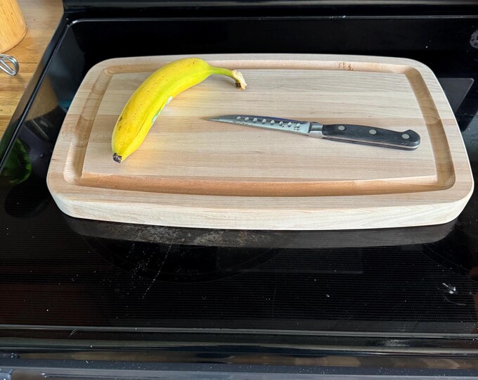 Personalized American maple edge grain cutting board with custom engraving by Design-Engrave.