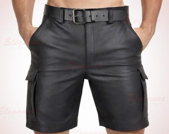 May include: Black leather shorts with a matching belt. The shorts have two cargo pockets on the sides and a belt with a silver buckle. The shorts are made of a smooth, matte leather material.