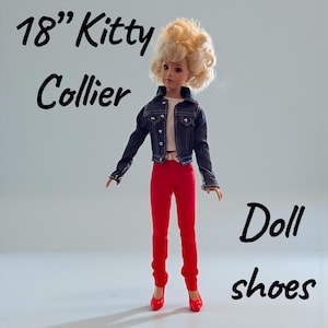 May include: An 18-inch doll named Kitty Collier wearing a denim jacket, red pants, and red shoes. The doll has blonde hair and is styled in a retro fashion. The words "Doll shoes" are written in black script.