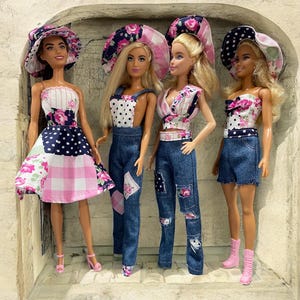 May include: Four dolls wearing different outfits and hats. The dolls are wearing denim, floral print, and polka dot patterns. The hats are pink and white with floral accents.