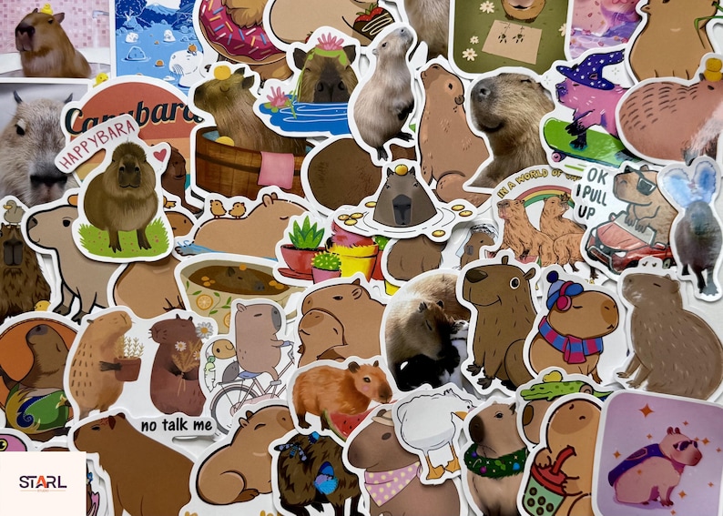 May include: A collection of colorful capybara stickers in various poses and settings. Some stickers feature capybaras in a bathtub, on a skateboard, and with accessories. The stickers have a white border and are on a white background.