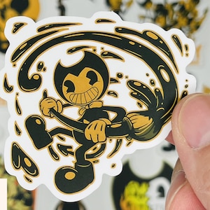 May include: A black and white sticker featuring a cartoon character, Bendy, from the video game Bendy and the Ink Machine. Bendy is depicted in a swirling ink-like pattern, holding a brush.