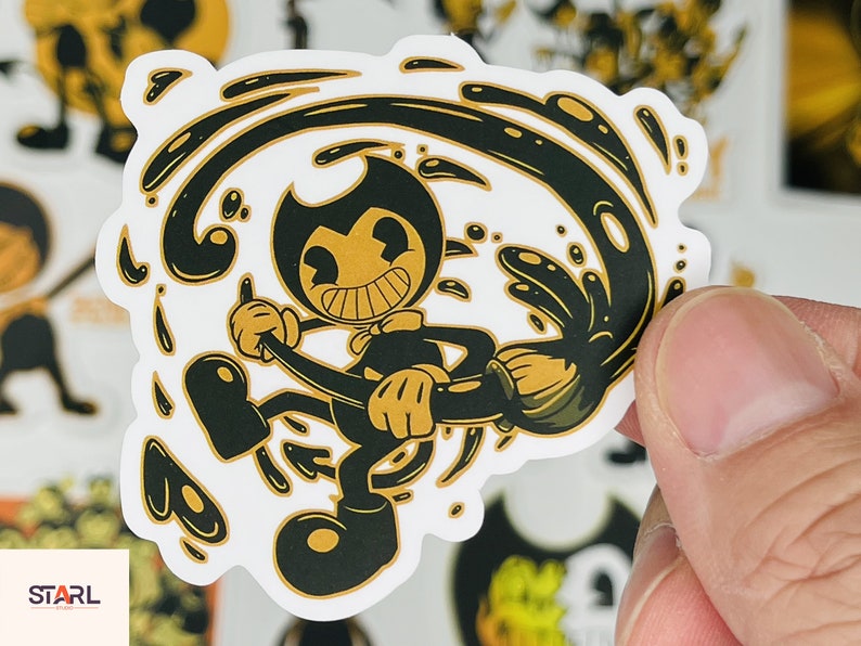 May include: A black and white sticker featuring a cartoon character, Bendy, from the video game Bendy and the Ink Machine. Bendy is depicted in a swirling ink-like pattern, holding a brush.