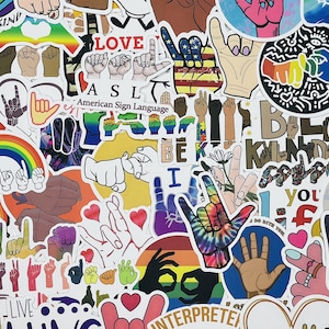 May include: A collection of colorful stickers featuring hand signs in American Sign Language (ASL). The stickers include phrases like "LOVE", "BE KIND", "ASL", "American Sign Language", "I", "YOU", "INTERPRETE", and "good vibes and good times".
