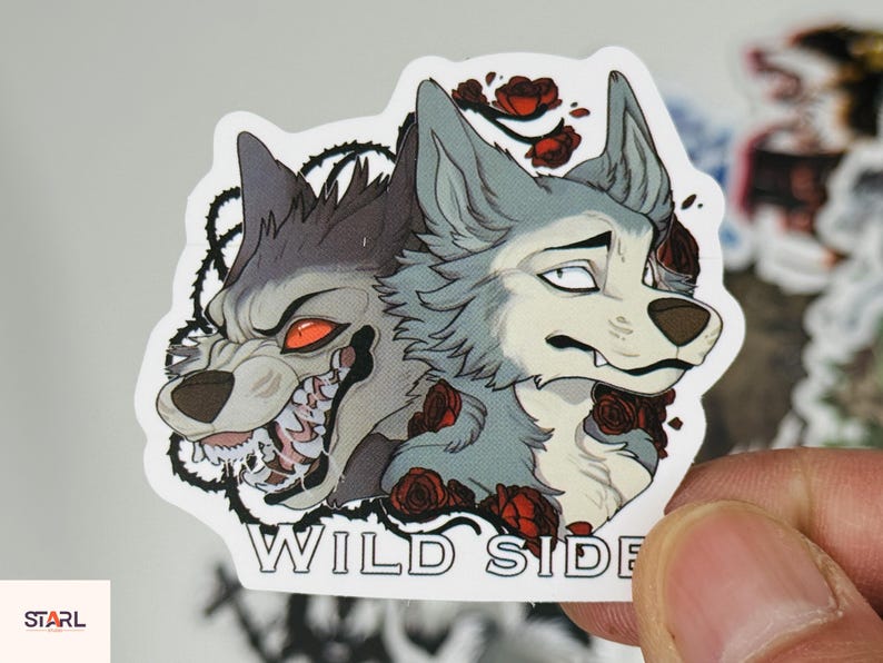 May include: A sticker featuring two wolf illustrations. One wolf is snarling with red eyes and exposed teeth, the other has a more neutral expression. Red roses and the words "WILD SIDE" are also included.