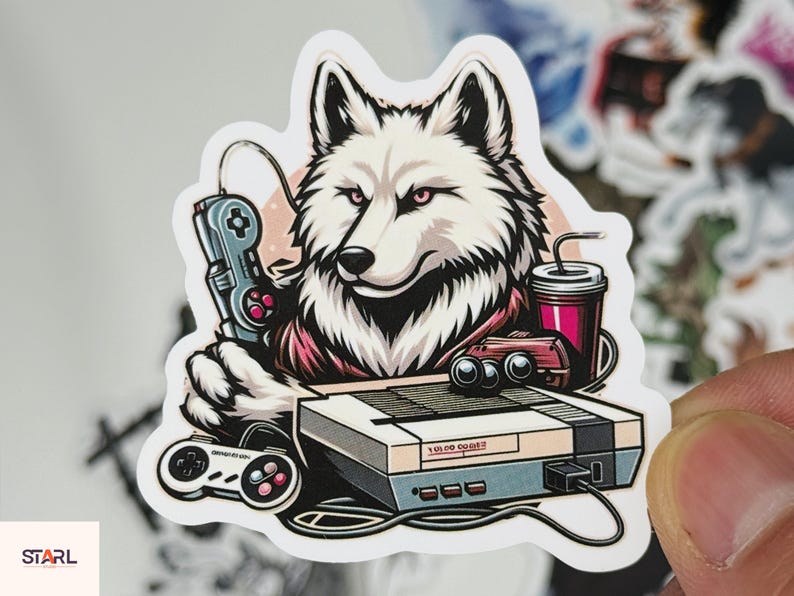 May include: A sticker featuring a white wolf with pink eyes holding a retro video game controller. The wolf is next to a console, a drink, and another controller. The sticker has a retro gaming theme.