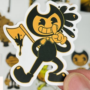 May include: A black and yellow cartoon character with a mischievous grin, holding a dripping axe. The character is wearing a black bow tie and has a splatter of black ink behind it.
