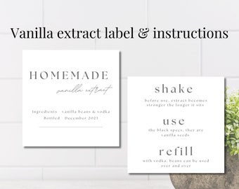 May include: A white label with black text that reads "HOMEMADE vanilla extract" and "Ingredients - vanilla beans & vodka Bottled - December 2023". A second white label with black text that reads "shake before use, extract becomes stronger the longer it sits use the black specs, they are vanilla seeds refill with vodka, beans can be used over and over".