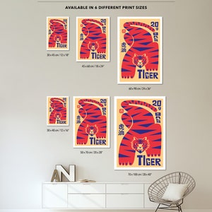 May include: A red and blue tiger illustration with Chinese characters and the word "Tiger" in a vintage style poster. The poster is available in six different sizes, ranging from 30 x 45 cm to 70 x 100 cm.