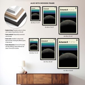 May include: A collection of framed Artemis II posters in various sizes, showcasing a retro-style design with a crescent moon and horizontal bands of color. The posters are displayed with wooden frames, and the dimensions range from 12x16 inches to 28x40 inches.