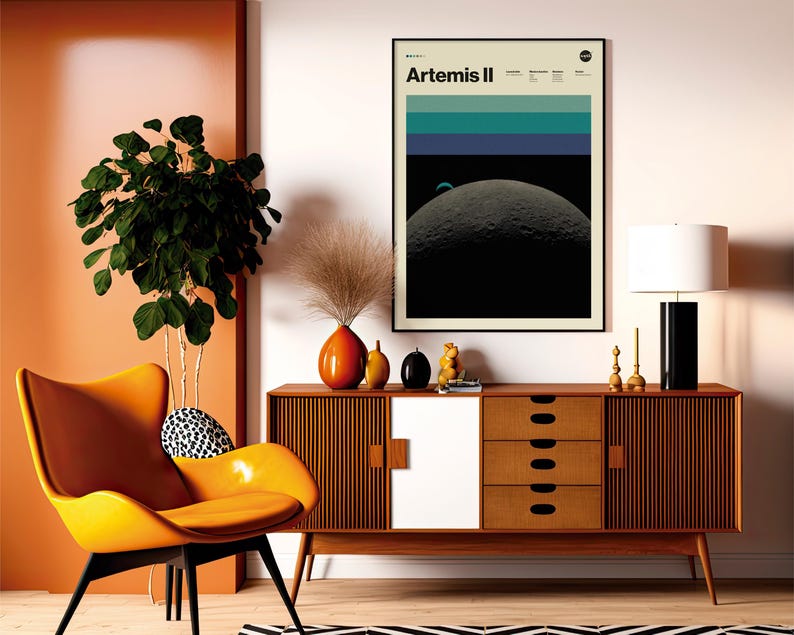 May include: A mid-century modern living room scene featuring an orange chair, a wooden cabinet, and a framed "Artemis II" poster. The room is decorated with a large plant, decorative vases, and a black and white patterned rug. A black and white lamp sits on the cabinet.