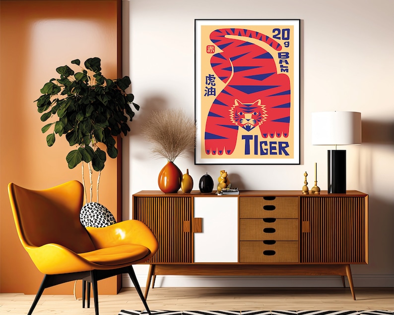 May include: A vintage-style poster featuring a red and blue tiger with the text "20 gram Tiger" and Chinese characters. The poster is framed and hanging on a white wall above a mid-century modern dresser.