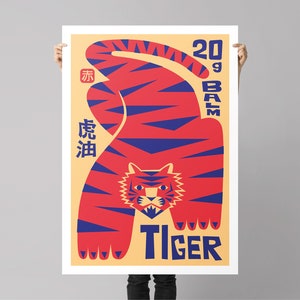 May include: A poster featuring a red and blue tiger illustration. The tiger is in a crouching position with its head facing forward. The poster has the text "20g Balm Tiger" and Chinese characters in blue.