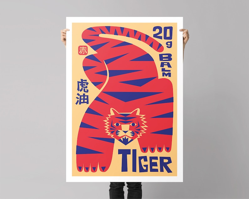 May include: A poster featuring a red and blue tiger illustration. The tiger is in a crouching position with its head facing forward. The poster has the text "20g Balm Tiger" and Chinese characters in blue.