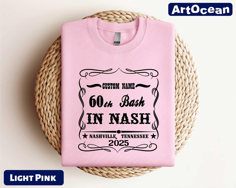a pink t - shirt with a black print on it
