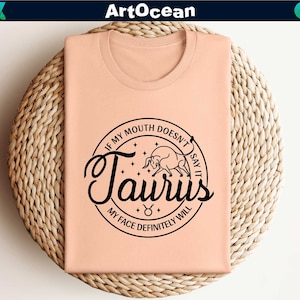 a pink t - shirt with the word taurus printed on it