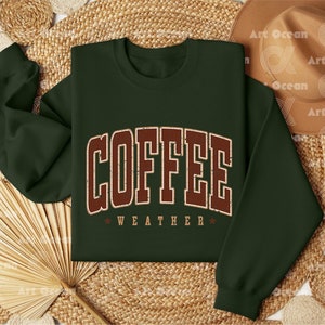 a green sweatshirt with the word coffee on it