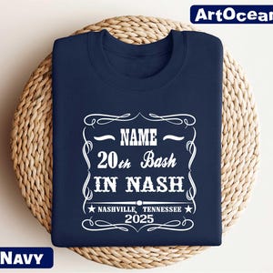 a navy t - shirt with a name and a picture on it